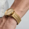Gold minimalist watch side view showing bracelet links and case thickness - AURA FASHION