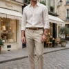 Man wearing AURA Fashion Mayfair Oxford Shirt with beige tailored trousers - old money quiet luxury outfit