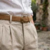 braided suede belt men tan styled with beige linen trousers