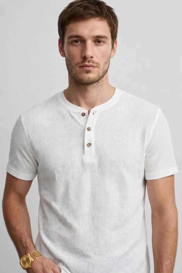 Man wearing gold minimalist watch with white waffle Henley t-shirt - old money style - AURA FASHION